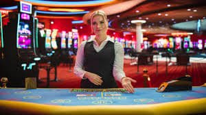 Roulette table interface showing bet placement grid and spinning wheel